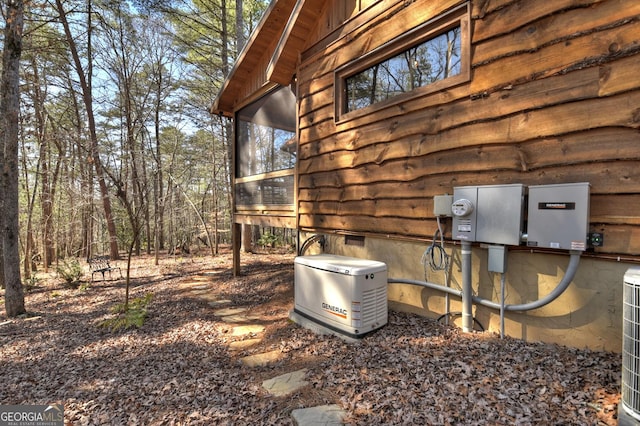 exterior details featuring a power unit, crawl space, and electric meter