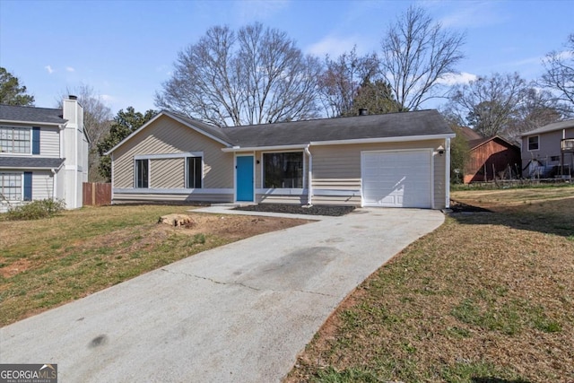 single story home featuring a garage, concrete driveway, and a front yard