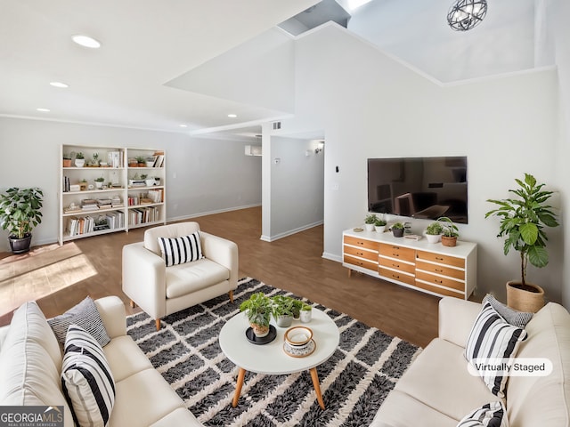 living area with recessed lighting, lofted ceiling, baseboards, and wood finished floors