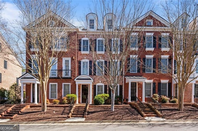 view of front of house featuring brick siding