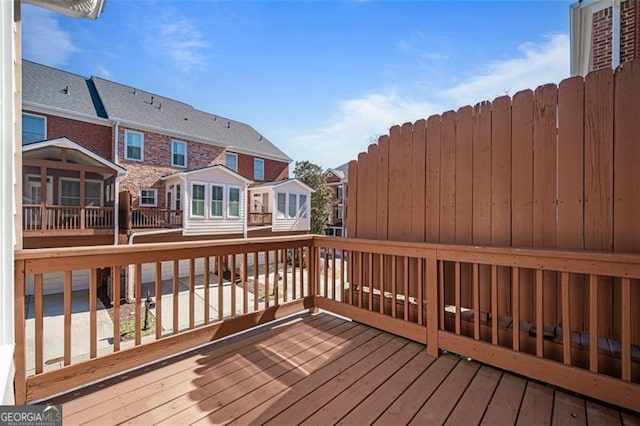 wooden deck with a residential view