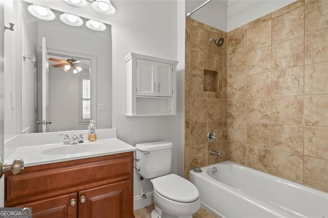 bathroom with washtub / shower combination, vanity, toilet, and a ceiling fan