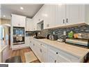 4335 Lakeside Blvd, Monroe, GA 30655 - kitchen with light countertops and white cabinetry