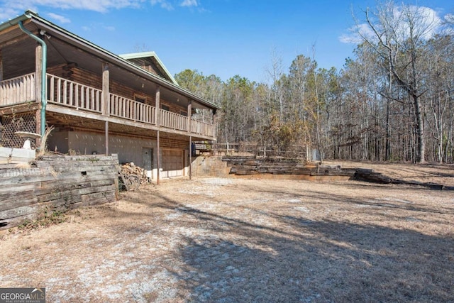 view of side of home featuring a garage and driveway