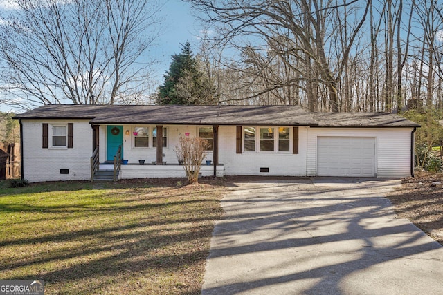 ranch-style house with driveway, brick siding, crawl space, an attached garage, and a front yard