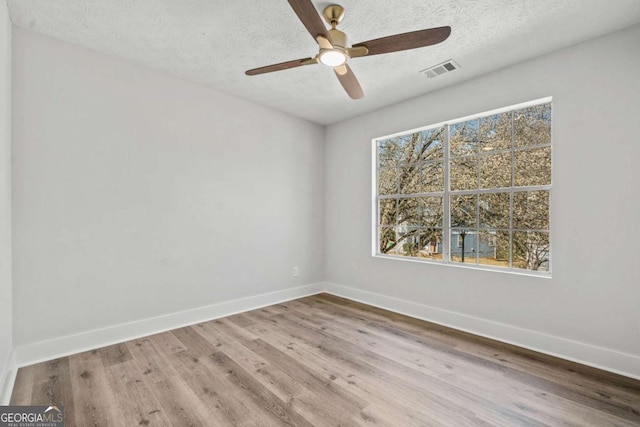 2111 Glenwood Downs Dr, Decatur, GA 30035 - unfurnished room featuring wood finished floors, a textured ceiling, and a ceiling fan