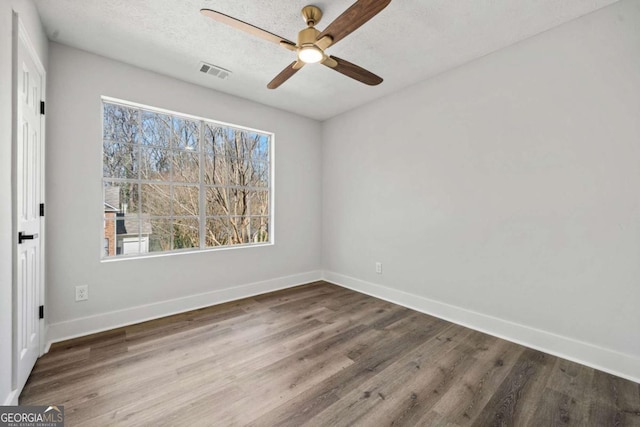 2111 Glenwood Downs Dr, Decatur, GA 30035 - spare room with wood finished floors and ceiling fan