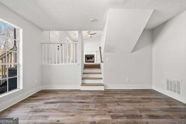 2111 Glenwood Downs Dr, Decatur, GA 30035 - stairs featuring vaulted ceiling, ceiling fan, and wood finished floors