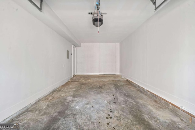 2111 Glenwood Downs Dr, Decatur, GA 30035 - garage with a garage door opener and baseboards