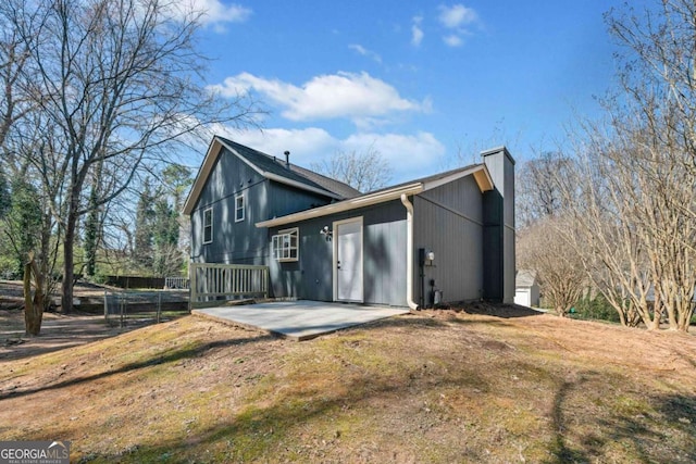 2111 Glenwood Downs Dr, Decatur, GA 30035 - back of house with a chimney, a patio, and a wooden deck