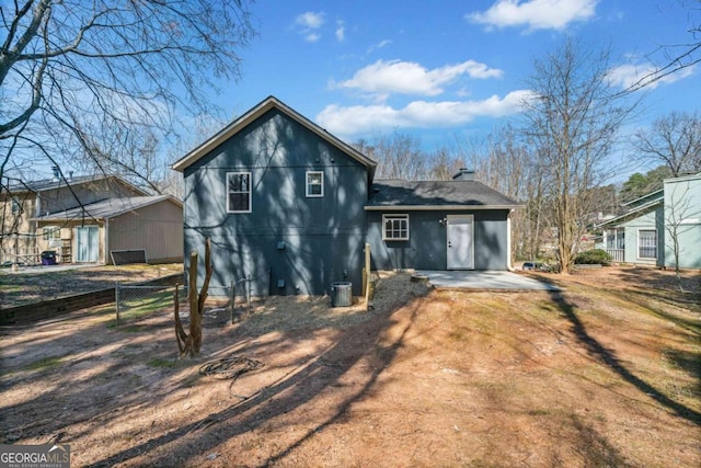 2111 Glenwood Downs Dr, Decatur, GA 30035 - rear view of house with a chimney and a patio