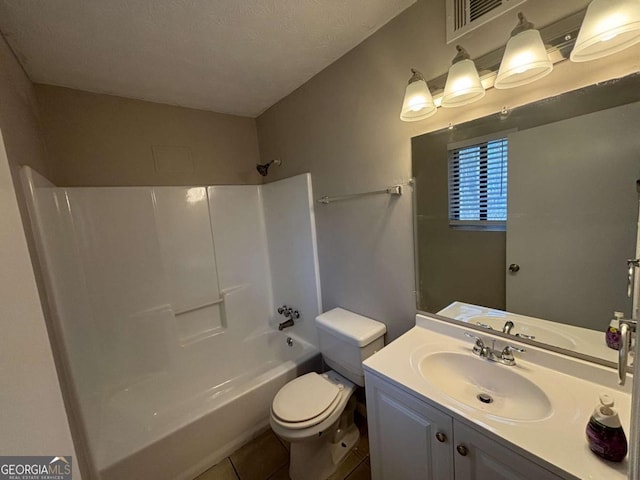 bathroom with bathtub / shower combination, visible vents, toilet, vanity, and tile patterned floors