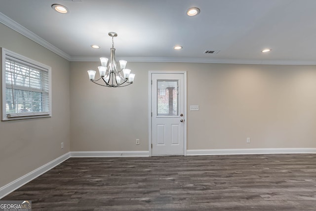 empty room with crown molding, baseboards, visible vents, and dark wood-style flooring