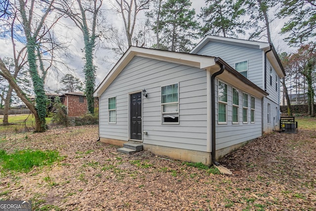 view of front of house featuring entry steps and central AC