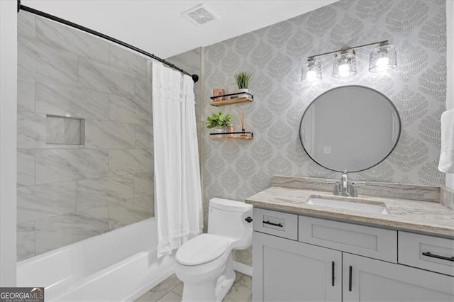 bathroom featuring visible vents, vanity, toilet, and wallpapered walls