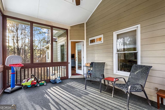 sunroom / solarium with lofted ceiling