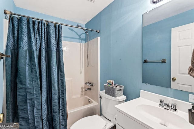 bathroom with toilet, shower / tub combo with curtain, and vanity