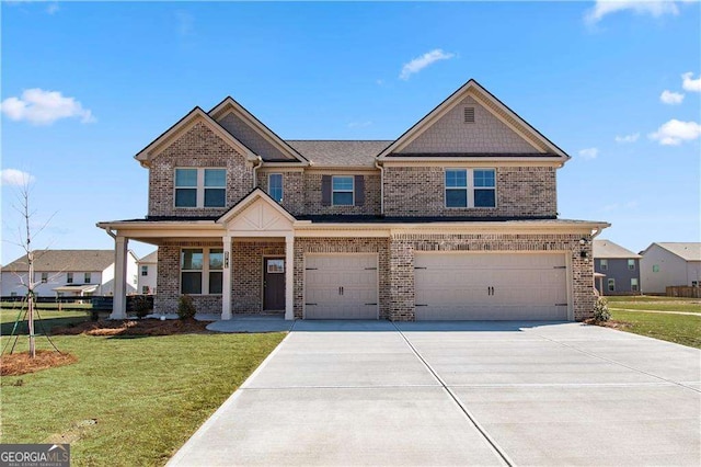 craftsman inspired home with a garage, driveway, brick siding, and a front yard