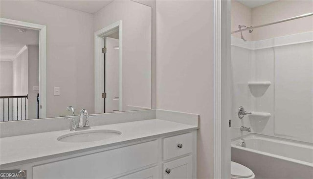 full bath featuring shower / washtub combination, vanity, and toilet