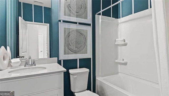 full bathroom featuring washtub / shower combination, visible vents, vanity, and toilet