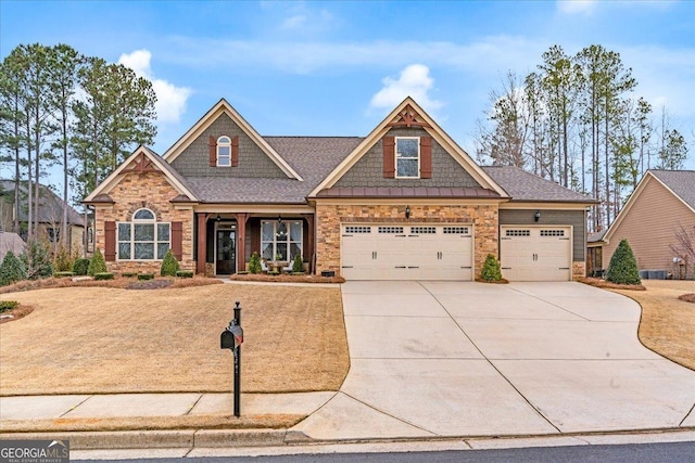 craftsman inspired home with driveway and stone siding