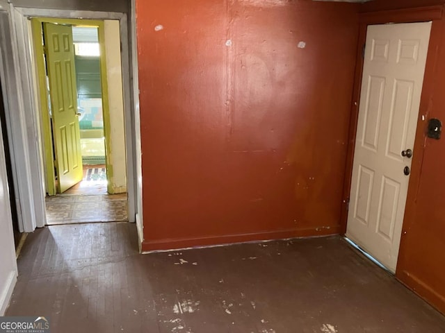 interior space with baseboards and hardwood / wood-style floors