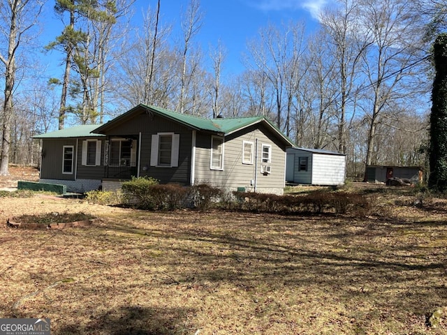 ranch-style house featuring metal roof