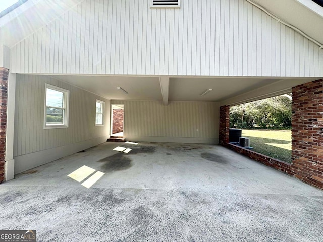 exterior space featuring driveway and an attached carport