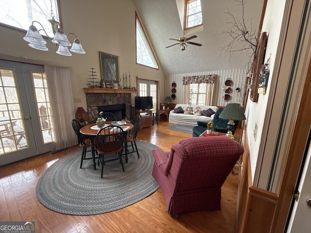 living room featuring a fireplace, wood finished floors, and french doors