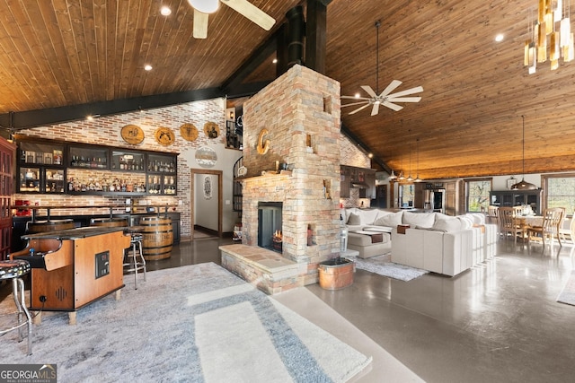 unfurnished living room featuring wooden ceiling, high vaulted ceiling, a fireplace, and a ceiling fan