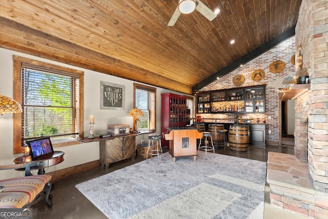 office with baseboards, lofted ceiling, wooden ceiling, a bar, and a ceiling fan