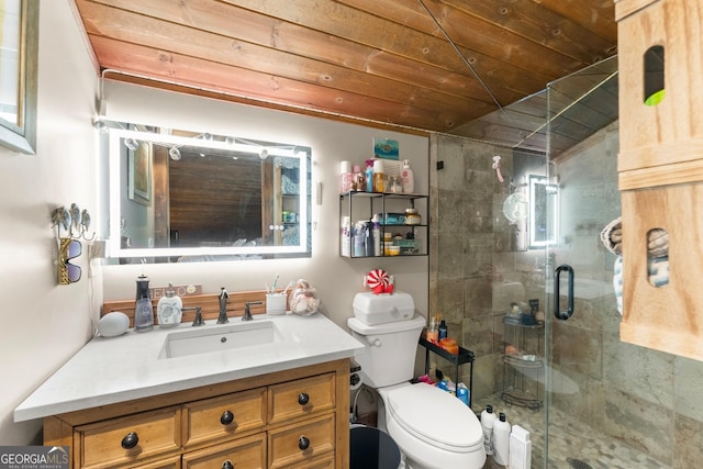 bathroom with toilet, a stall shower, and vanity