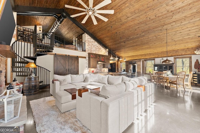 living room featuring stairs, high vaulted ceiling, wood ceiling, and a ceiling fan