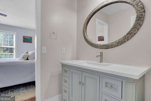 bathroom featuring ensuite bath and vanity