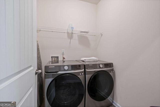 laundry area featuring laundry area and washer and clothes dryer