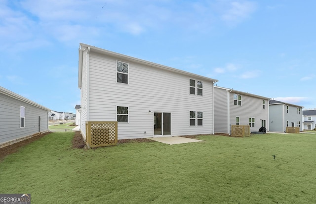 rear view of property featuring a patio area and a lawn