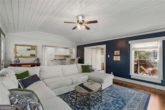 living room with lofted ceiling, wood ceiling, ceiling fan, wood finished floors, and baseboards