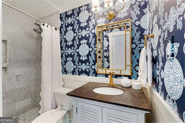 bathroom with toilet, a chandelier, a tile shower, and vanity