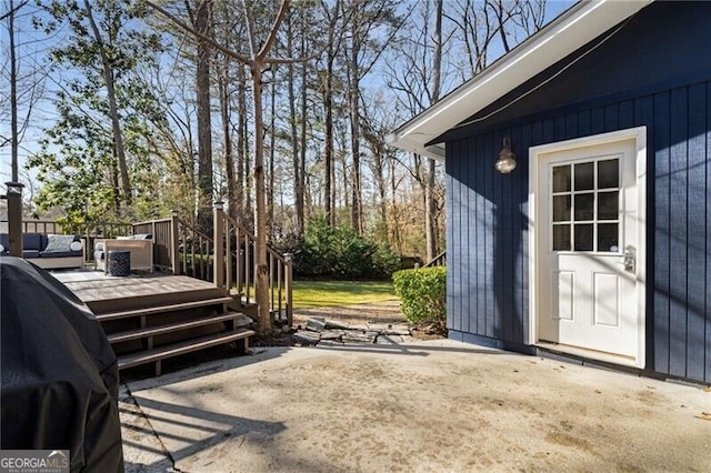 view of patio featuring a grill and a deck