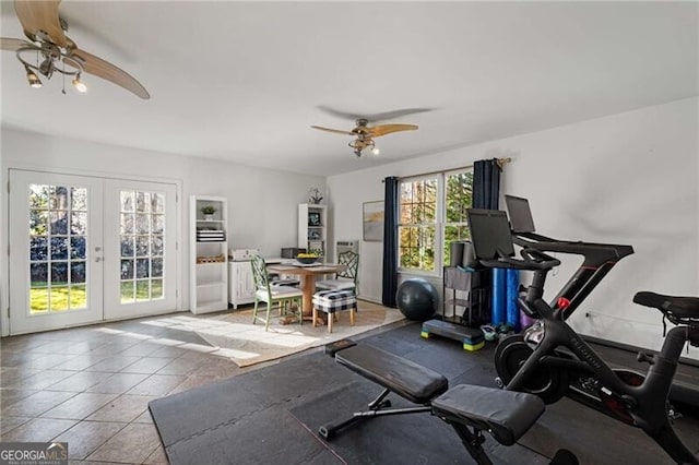 exercise room featuring french doors, a ceiling fan, and tile patterned floors