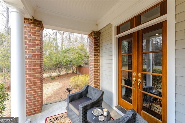 view of patio / terrace with french doors and fence