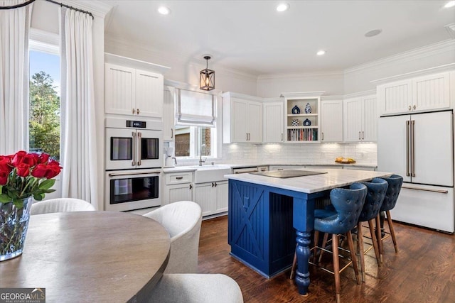 kitchen with white appliances, dark wood-style flooring, a center island, white cabinetry, and open shelves