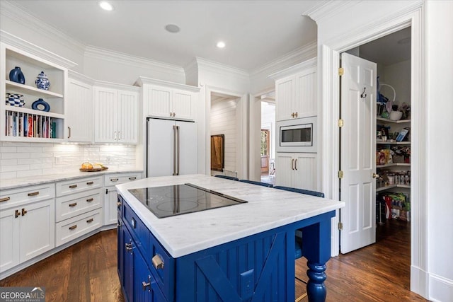 kitchen featuring blue cabinetry, dark wood-style floors, white cabinets, and built in appliances