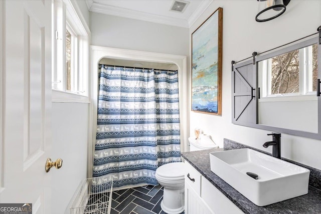 bathroom with crown molding, visible vents, toilet, vanity, and a shower with curtain