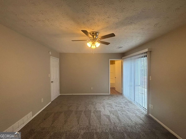 unfurnished bedroom with a ceiling fan, carpet, a textured ceiling, and baseboards