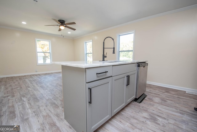 kitchen featuring baseboards, stainless steel dishwasher, light wood-style floors, and crown molding