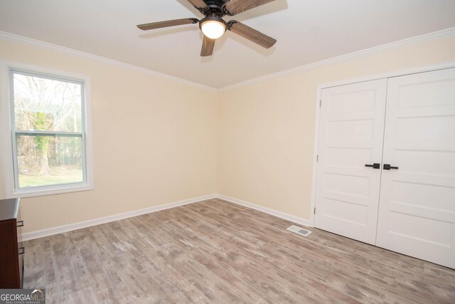 bathroom featuring a freestanding tub, ornamental molding, walk in shower, and tile patterned floors