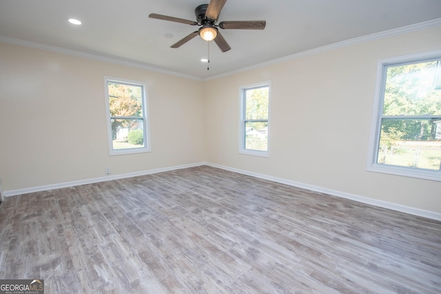 unfurnished room featuring recessed lighting, wood finished floors, a ceiling fan, baseboards, and crown molding