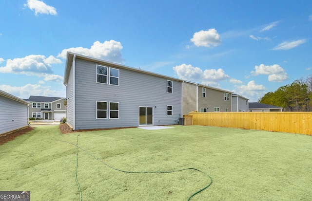 back of property featuring a patio area and fence