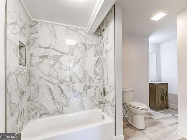 bathroom featuring baseboards, bathing tub / shower combination, toilet, marble finish floor, and vanity